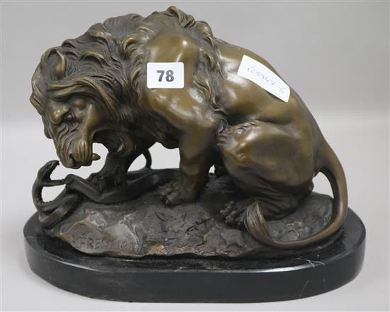 A bronze lion on base, signed height 24cm width 30cm